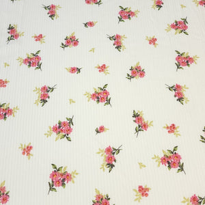 Ribbed Knit Fabric: 4x2 Rib Knit . Cute Ivory with Petite and Pretty Pink Flowers with Green Leaves. 4-Way Stretch, Sold by the 1/2 yard