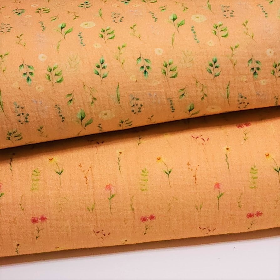 100% Cotton Double Gauze Muslin Fabric with Dainty Floral prints on Peach Gauze. Nice Quality soft European Fabric. Sold by the 1/2 yard.