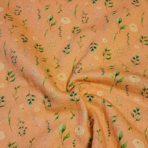 100% Cotton Double Gauze Muslin Fabric with Dainty Floral prints on Peach Gauze. Nice Quality soft European Fabric. Sold by the 1/2 yard.