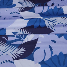 Load image into Gallery viewer, SWIM Fabric: Nylon Spandex Knit, Tropical Leaf Pattern in Varigated Blue. Very Nice Quality Activewear and Swim Fabric. Sold by the 1/2 yard
