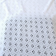 Load image into Gallery viewer, White Eyelet Poly Spandex Knit Fabric, Stretch Knit Fabric, 55 inches Wide. Ideal for Apparel and Home Decor. Sold by the 1/2 yard.
