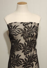 Load image into Gallery viewer, Beautiful Black Glittery Lace leaves on Gray Fishnet Lace, Unique and Trendy Lace, Ideal for Apparel and Home Decor. Sold by the 1/2 yard.
