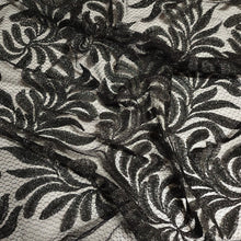 Load image into Gallery viewer, Beautiful Black Glittery Lace leaves on Gray Fishnet Lace, Unique and Trendy Lace, Ideal for Apparel and Home Decor. Sold by the 1/2 yard.
