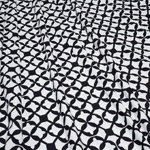 Load image into Gallery viewer, SWIM Fabric: Nylon Spandex Knit, Swimwear Fabric, Stylish Black and White Print. Very Nice For Swimsuit and Activewear. Sold by the 1/2 yard
