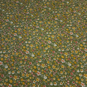 Rayon Crepe Fabric, Green with Yellow and White Ditsy Floral Print. Light and Flowy Fabric. 100% Rayon Woven Fabric. Sold by the 1/2 yard