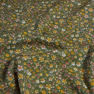 Rayon Crepe Fabric, Green with Yellow and White Ditsy Floral Print. Light and Flowy Fabric. 100% Rayon Woven Fabric. Sold by the 1/2 yard