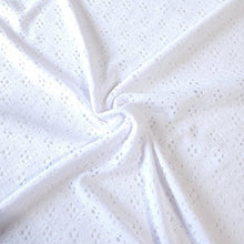 Load image into Gallery viewer, White Eyelet Poly Spandex Knit Fabric, Stretch Knit Fabric, 55 inches Wide. Ideal for Apparel and Home Decor. Sold by the 1/2 yard.
