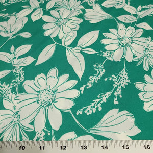 Poly Spandex Knit White Floral on Green, Nice and Flowy Drape, Perfect for Sewing Apparel, 2 Way Stretch Knit Fabric, Sold By The 1/2 Yard