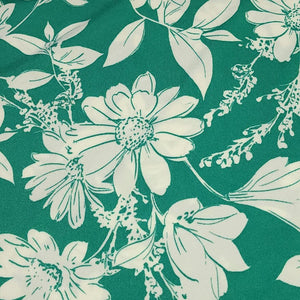 Poly Spandex Knit White Floral on Green, Nice and Flowy Drape, Perfect for Sewing Apparel, 2 Way Stretch Knit Fabric, Sold By The 1/2 Yard