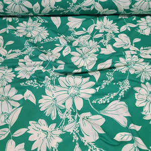 Poly Spandex Knit White Floral on Green, Nice and Flowy Drape, Perfect for Sewing Apparel, 2 Way Stretch Knit Fabric, Sold By The 1/2 Yard