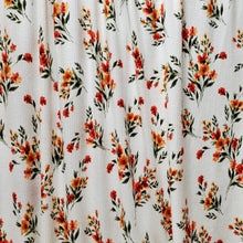 Load image into Gallery viewer, Ribbed Knit Stretch Fabric. 4 way stretch. Very Pretty Ivory with Orange and Green floral print. Fabric is sold by the 1/2 Yard .
