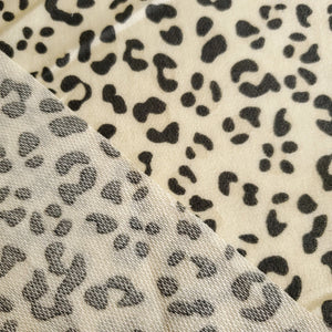 French Terry Stretch Knit Fabric, Cream/Gray Leopard Cheetah Print, Poly Rayon Spandex Tri Blend.  2-way stretch. Sold by the 1/2 yard