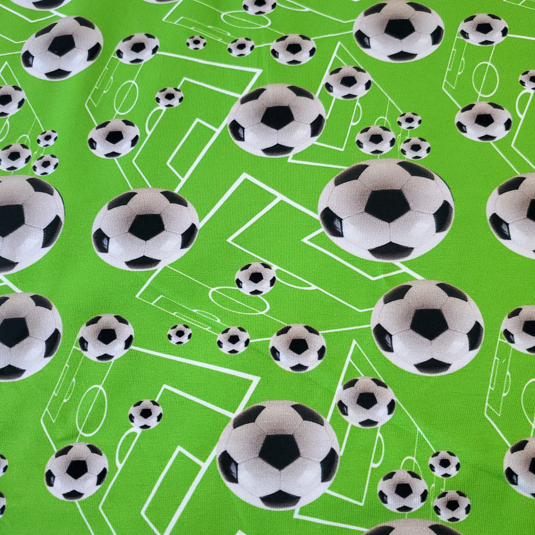 Cotton Spandex Euro Knit Fabric: Soccer Ball on Neon Green Geometric Design, Excellent Quality Fabric, 4-way stretch . Sold by the 1/2 yard.