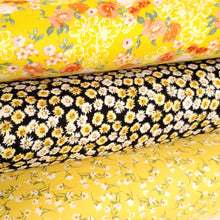 Load image into Gallery viewer, Double Brushed Poly, DPB,  Knit Fabric, Beautiful Ditzy White and Yellow Flowers on Black, So Soft and Versatile, Sold by the 1/2 yard
