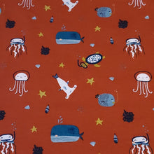 Load image into Gallery viewer, Organic Cotton Spandex Euro Knit Fabric: Snorkeling Sea Life on Brick Red, Nice Quality Soft Fabric, 4-way stretch. Sold by the 1/2 yard.
