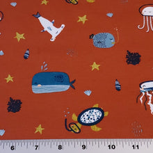 Load image into Gallery viewer, Organic Cotton Spandex Euro Knit Fabric: Snorkeling Sea Life on Brick Red, Nice Quality Soft Fabric, 4-way stretch. Sold by the 1/2 yard.
