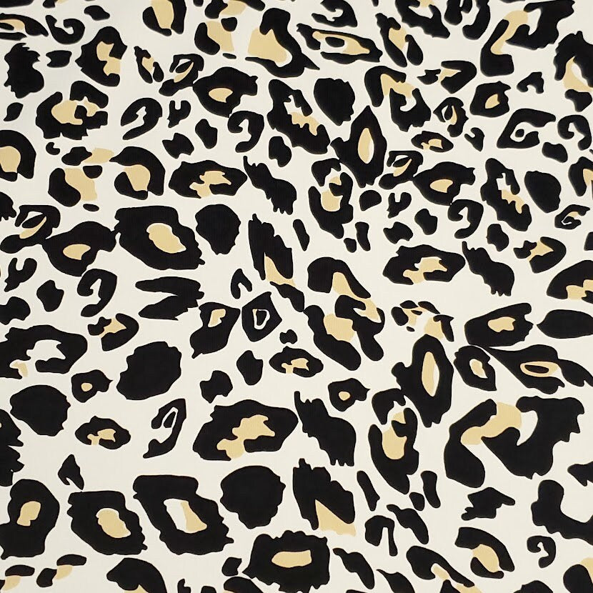 SWIM Fabric: Nylon Spandex Knit, Fun Black, Beige, and White Cheetah Print. Very Nice Quality Activewear and Swimwear. Sold by the 1/2 yard