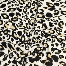 Load image into Gallery viewer, SWIM Fabric: Nylon Spandex Knit, Fun Black, Beige, and White Cheetah Print. Very Nice Quality Activewear and Swimwear. Sold by the 1/2 yard
