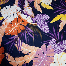 Load image into Gallery viewer, Lightweight Cotton Knit Fabric, Pretty Purple, Coral, and Yellow Tropical Print on Navy. 2-way stretch. Sold by the 1/2 yard
