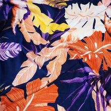 Load image into Gallery viewer, Lightweight Cotton Knit Fabric, Pretty Purple, Coral, and Yellow Tropical Print on Navy. 2-way stretch. Sold by the 1/2 yard
