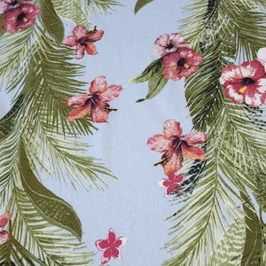 Lightweight Cotton Knit Fabric, Tropical Hibiscus Flowers with Green Leaves on Sky Blue. 2-way stretch. Sold by the 1/2 yard