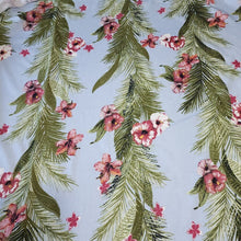 Load image into Gallery viewer, Lightweight Cotton Knit Fabric, Tropical Hibiscus Flowers with Green Leaves on Sky Blue. 2-way stretch. Sold by the 1/2 yard
