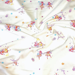 Spandex Blend Knit Fabric, 4-Way Stretch, Cute Fairies and Castle Print on Cream. Cute and So Comfortable, Sold by the 1/2 yard