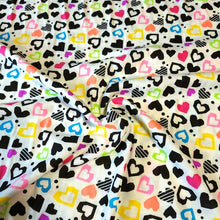 Load image into Gallery viewer, Fun Colorful Heart Knit Fabric. Cotton Blend T-Shirt Knit. Cute Fabric, Lightweight and Soft 2-way stretch Fabric. Sold by the 1/2 yard
