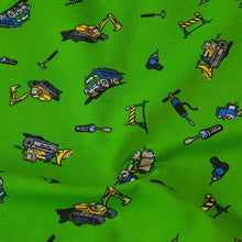 Load image into Gallery viewer, Cotton Spandex Stretch Knit Jersey Fabric, Construction Trucks on Green, Fun and Durable 4-way stretch Fabric.  Sold by the 1/2 yard
