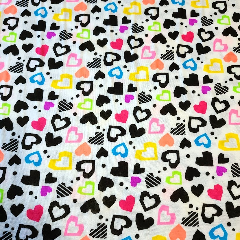 Fun Colorful Heart Knit Fabric. Cotton Blend T-Shirt Knit. Cute Fabric, Lightweight and Soft 2-way stretch Fabric. Sold by the 1/2 yard