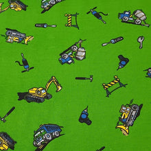 Load image into Gallery viewer, Cotton Spandex Stretch Knit Jersey Fabric, Construction Trucks on Green, Fun and Durable 4-way stretch Fabric.  Sold by the 1/2 yard
