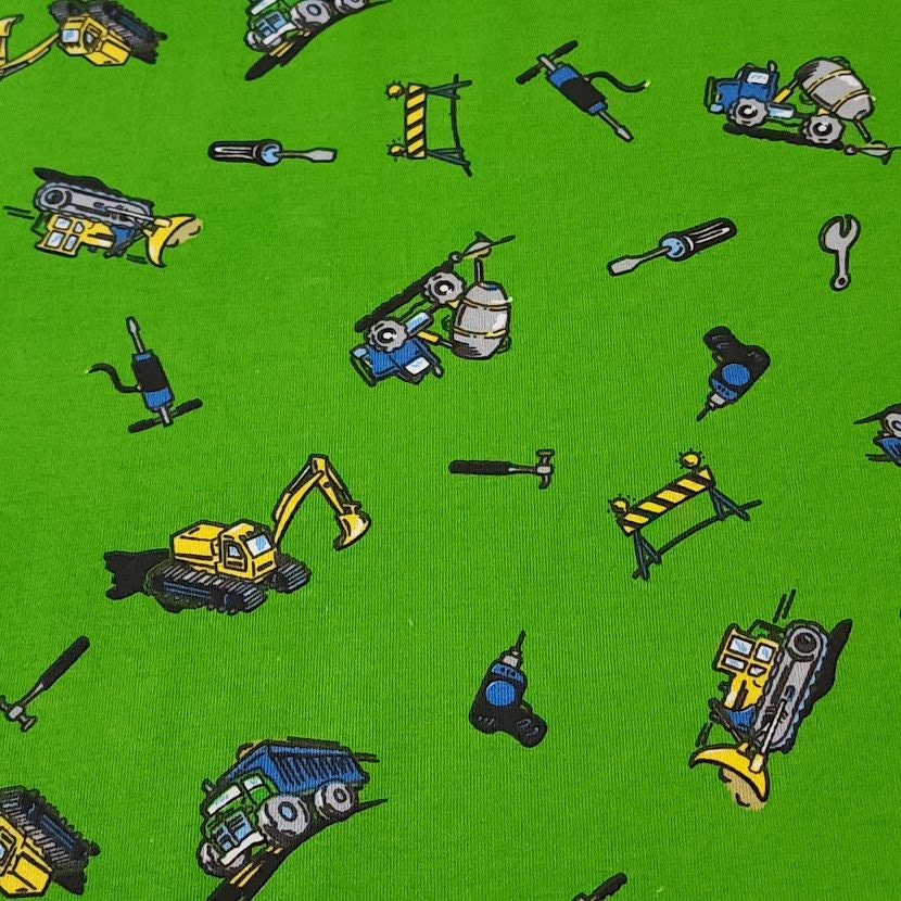 Cotton Spandex Stretch Knit Jersey Fabric, Construction Trucks on Green, Fun and Durable 4-way stretch Fabric.  Sold by the 1/2 yard