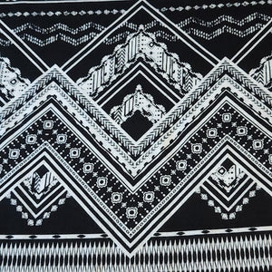 Rayon Challis Fabric. Black and White Boho Print. A Very Nice Light and Flowing Fabric. Nice Rayon Woven Fabric. Sold by the 1/2 yard