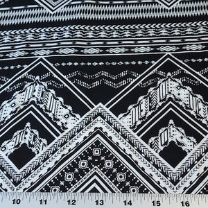 Rayon Challis Fabric. Black and White Boho Print. A Very Nice Light and Flowing Fabric. Nice Rayon Woven Fabric. Sold by the 1/2 yard