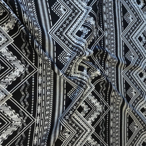 Rayon Challis Fabric. Black and White Boho Print. A Very Nice Light and Flowing Fabric. Nice Rayon Woven Fabric. Sold by the 1/2 yard