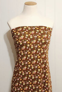 Rib Knit Fabric Brown Rib Knit Fabric with Yellow and Pink Floral Print on Ribbed Poly Spandex 4 Way Stretch Fabric. Sold by the 1/2 Yard.