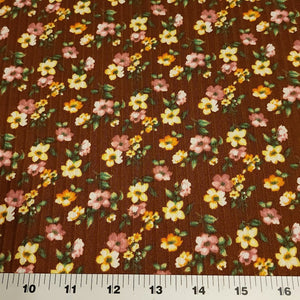 Rib Knit Fabric Brown Rib Knit Fabric with Yellow and Pink Floral Print on Ribbed Poly Spandex 4 Way Stretch Fabric. Sold by the 1/2 Yard.