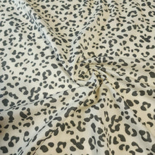 Load image into Gallery viewer, French Terry Stretch Knit Fabric, Cream/Gray Leopard Cheetah Print, Poly Rayon Spandex Tri Blend.  2-way stretch. Sold by the 1/2 yard
