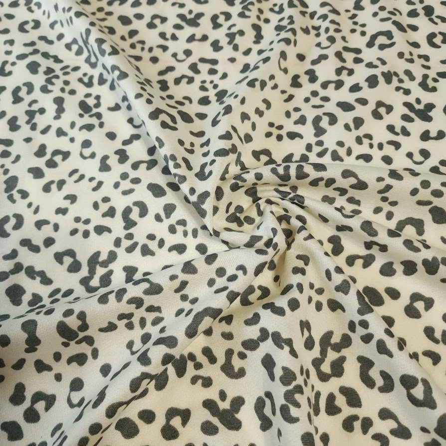 French Terry Stretch Knit Fabric, Cream/Gray Leopard Cheetah Print, Poly Rayon Spandex Tri Blend.  2-way stretch. Sold by the 1/2 yard